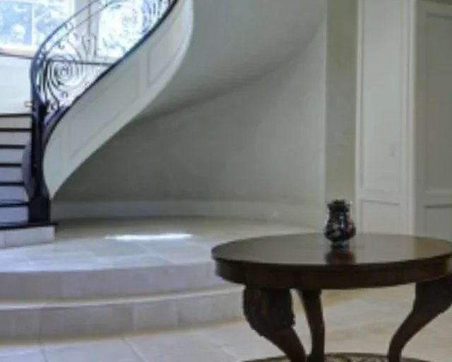 Grand curved staircase in a high-value residence