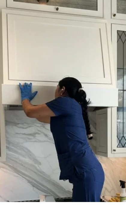 Royal Glow cleaner cleaning a kitchen range hood