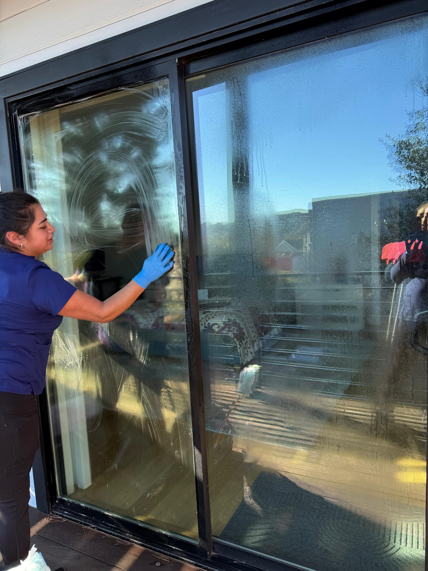 Sliding glass door being cleaned by Royal Glow Cleaning