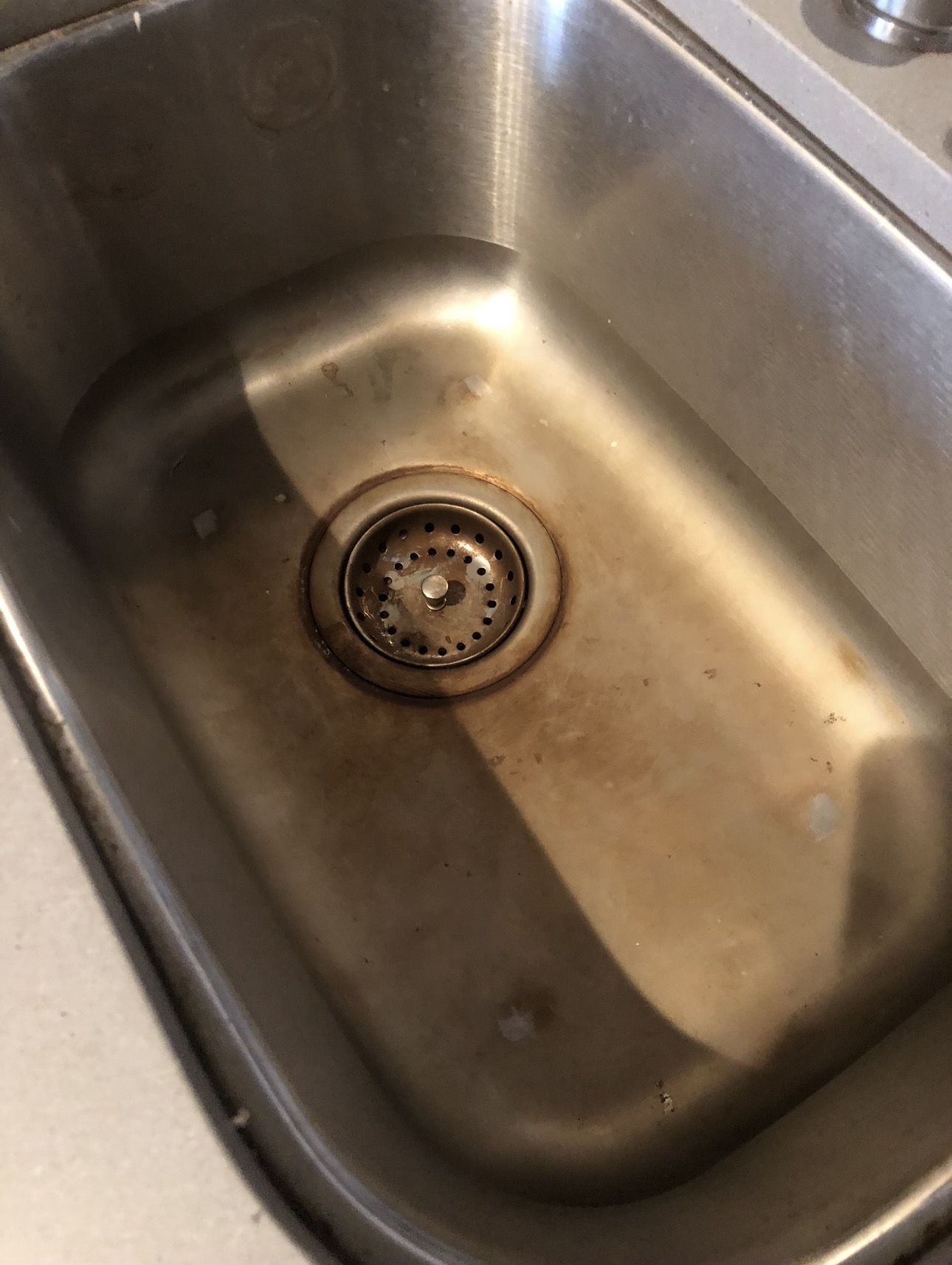 Stained kitchen sink before Royal Glow Cleaning